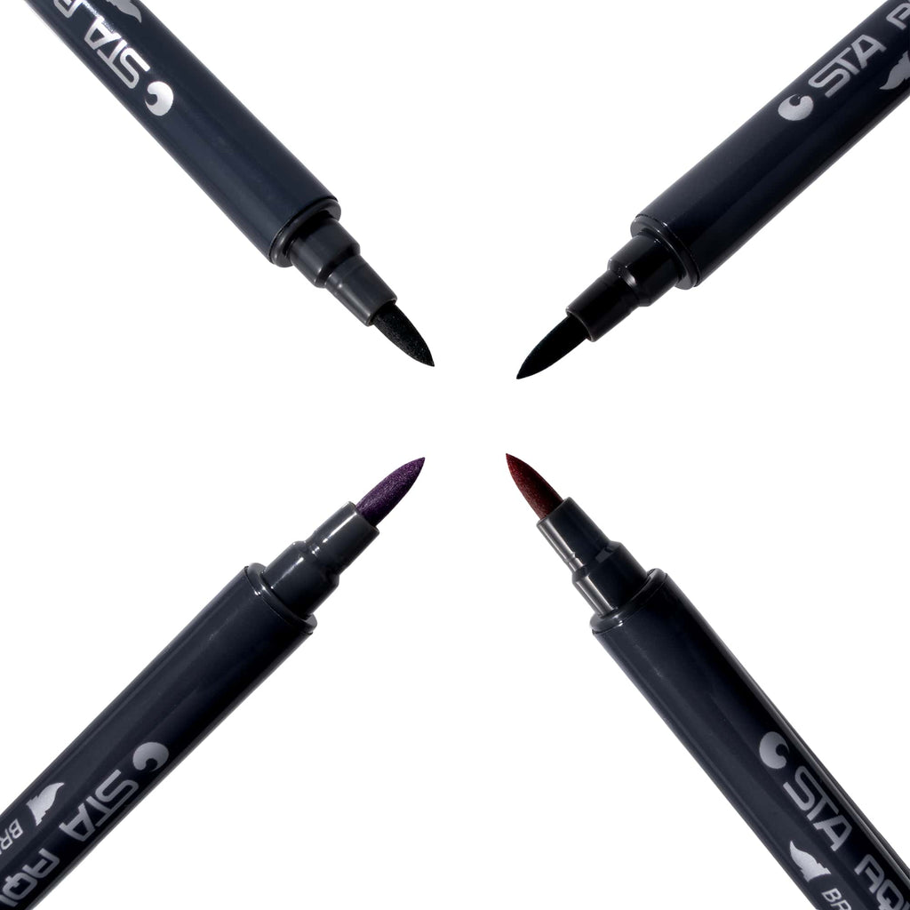 Four brush markers arranged in a cross, tips meeting at the centre
