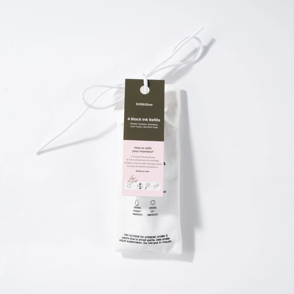 Ink refill packaging shown hanging by a string, with the product information visible